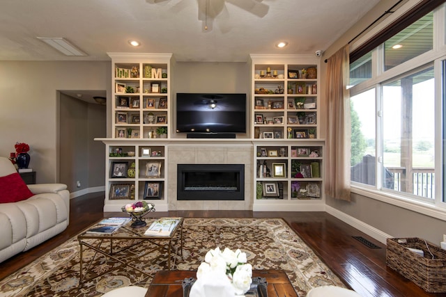 4604 E Kentbrook Dr, Springfield, MO 65802 - living room with healthy amount of natural light, ceiling fan, dark wood-type flooring, a fireplace, and recessed lighting