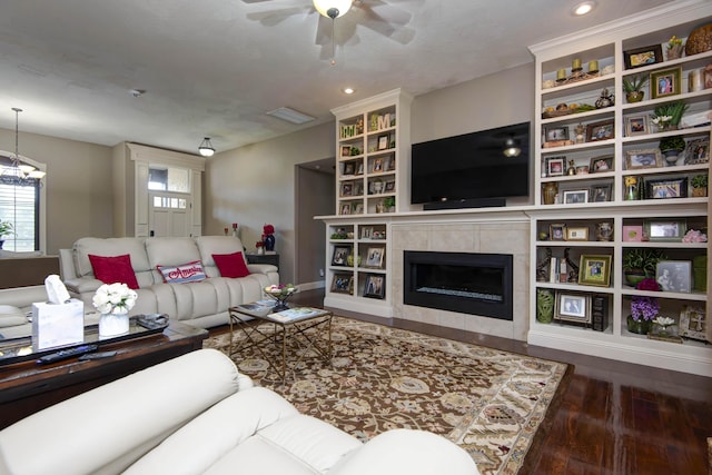 4604 E Kentbrook Dr, Springfield, MO 65802 - living area featuring hardwood / wood-style flooring, ceiling fan, a fireplace, recessed lighting, and built in features