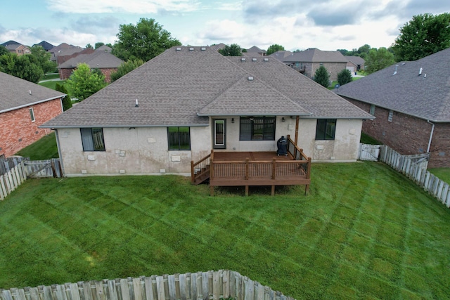 4604 E Kentbrook Dr, Springfield, MO 65802 - rear view of house with a gate, stucco siding, a shingled roof, a wooden deck, and a fenced backyard