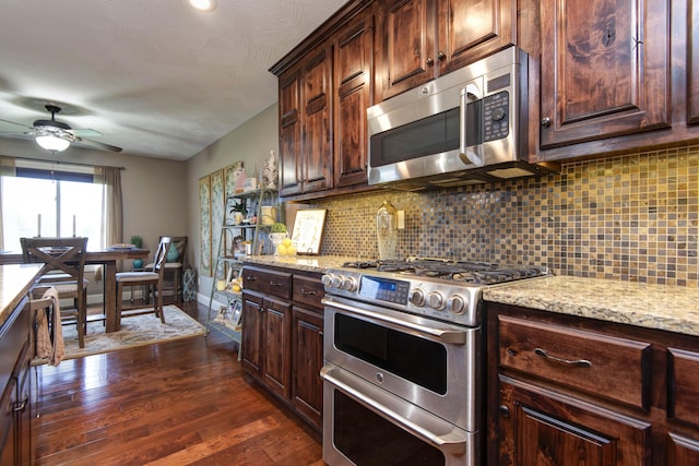 4604 E Kentbrook Dr, Springfield, MO 65802 - kitchen featuring appliances with stainless steel finishes, ceiling fan, decorative backsplash, dark wood-style flooring, and light stone counters