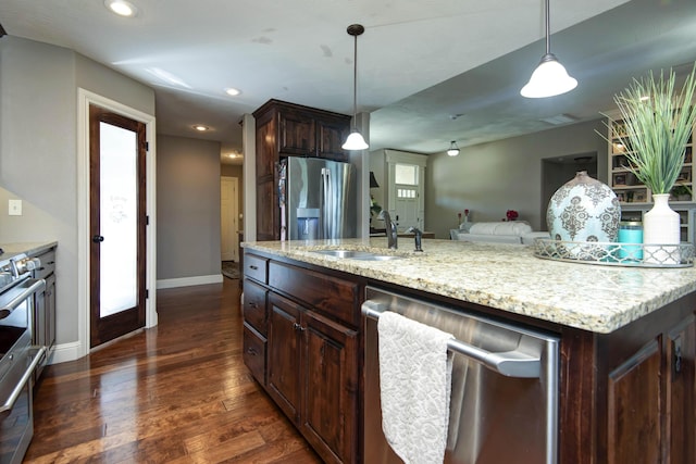 4604 E Kentbrook Dr, Springfield, MO 65802 - kitchen with stainless steel appliances, dark wood-style floors, dark brown cabinetry, hanging light fixtures, and recessed lighting