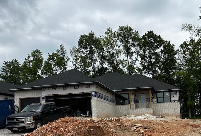 5555 E Wild Horse Dr, Springfield, MO 65802 - view of front of home with a garage