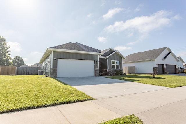 622 N Dean Ln, Republic, MO 65738 - view of front facade with a garage, stone siding, driveway, board and batten siding, and roof with shingles