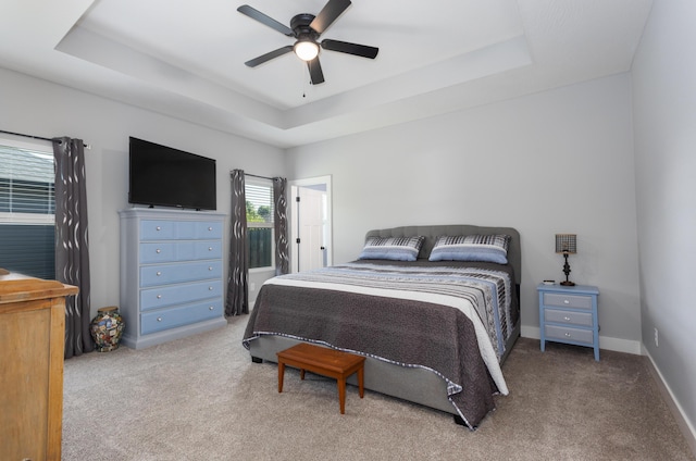 622 N Dean Ln, Republic, MO 65738 - carpeted bedroom with a tray ceiling and a ceiling fan