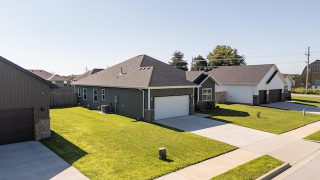 622 N Dean Ln, Republic, MO 65738 - view of front of house featuring roof with shingles, a front lawn, concrete driveway, and an attached garage