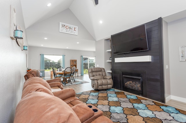 622 N Dean Ln, Republic, MO 65738 - living room featuring wood finished floors, recessed lighting, a large fireplace, and high vaulted ceiling