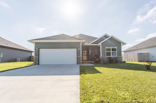 622 N Dean Ln, Republic, MO 65738 - view of front of house featuring board and batten siding, stone siding, and a garage