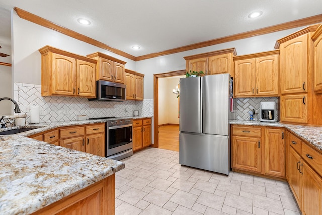 217 E Grace St, Republic, MO 65738 - kitchen with appliances with stainless steel finishes, crown molding, light stone counters, backsplash, and recessed lighting