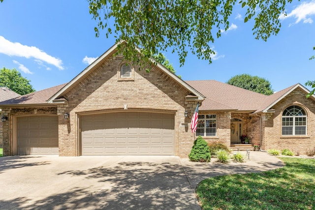 217 E Grace St, Republic, MO 65738 - single story home featuring brick siding, an attached garage, driveway, and roof with shingles