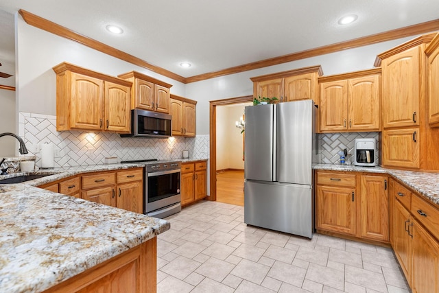 217 E Grace St, Republic, MO 65738 - kitchen with appliances with stainless steel finishes, crown molding, light stone countertops, decorative backsplash, and recessed lighting