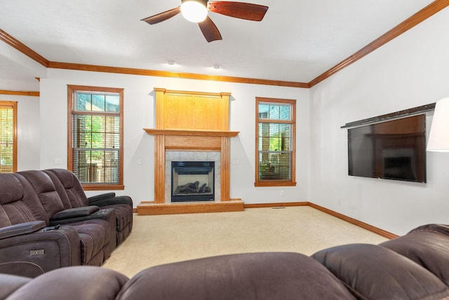 217 E Grace St, Republic, MO 65738 - carpeted living room featuring a fireplace with raised hearth, crown molding, and ceiling fan