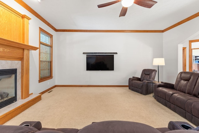 217 E Grace St, Republic, MO 65738 - living room featuring a fireplace, carpet flooring, ornamental molding, and ceiling fan