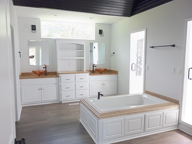 6540 Gateway Dr, Joplin, MO 64804 - bathroom with wood finished floors, a bath, and vanity