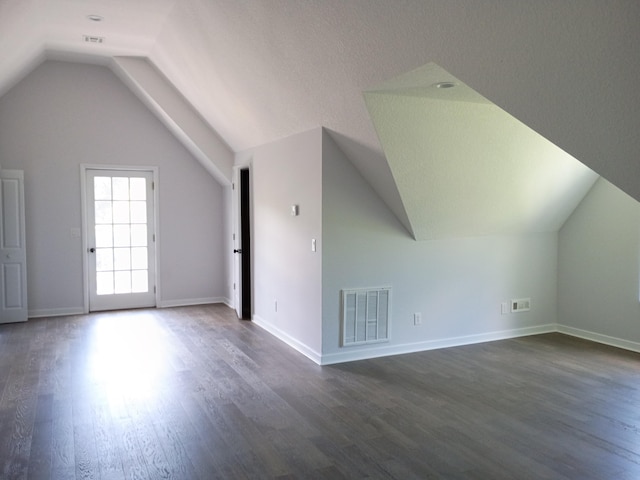 6540 Gateway Dr, Joplin, MO 64804 - bonus room featuring vaulted ceiling and dark wood finished floors