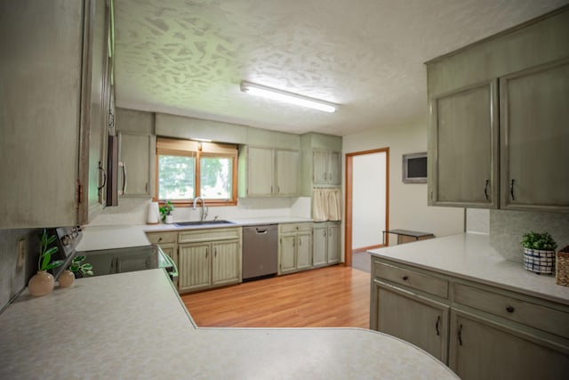 619 Rte H, Greenfield, MO 65661 - kitchen with appliances with stainless steel finishes, light countertops, light wood finished floors, and a textured ceiling