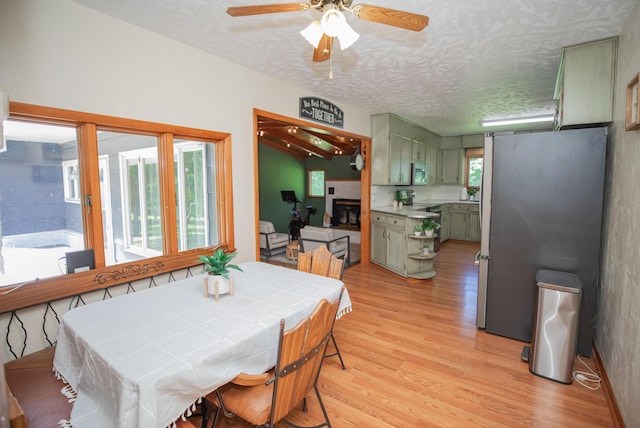 619 Rte H, Greenfield, MO 65661 - dining area with light wood finished floors, ceiling fan, and a textured ceiling