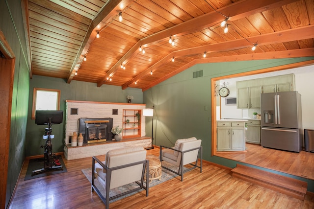 619 Rte H, Greenfield, MO 65661 - living room featuring rail lighting, wooden ceiling, and light wood finished floors