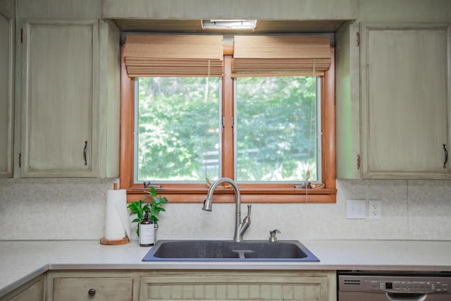 619 Rte H, Greenfield, MO 65661 - kitchen featuring dishwashing machine, light countertops, and decorative backsplash