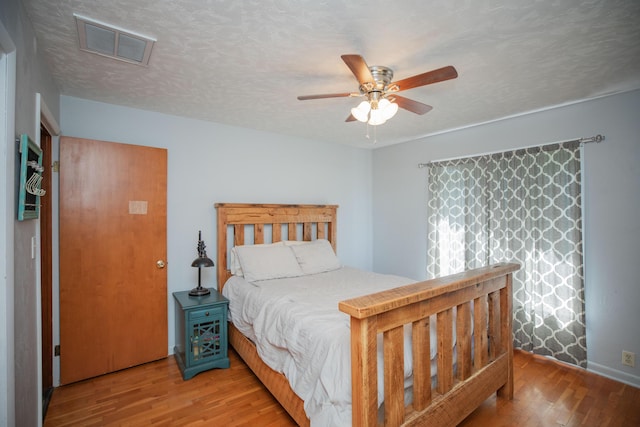 619 Rte H, Greenfield, MO 65661 - bedroom with wood finished floors and a ceiling fan