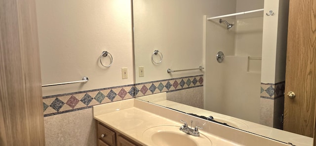 2830 N Washington Ave, Springfield, MO 65803 - full bath featuring tile walls, vanity, wainscoting, and a shower