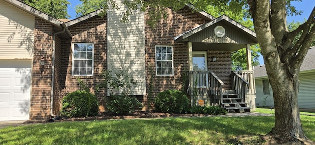 2830 N Washington Ave, Springfield, MO 65803 - view of front of property featuring brick siding, a front yard, a chimney, and a garage