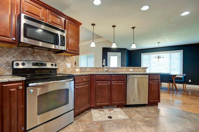 645 Galileo Dr, Nixa, MO 65714 - kitchen featuring stainless steel appliances, backsplash, crown molding, a peninsula, and plenty of natural light