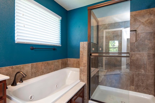 645 Galileo Dr, Nixa, MO 65714 - bathroom with a jetted tub, a stall shower, and vanity