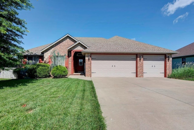 645 Galileo Dr, Nixa, MO 65714 - ranch-style house featuring brick siding, an attached garage, concrete driveway, and a front yard