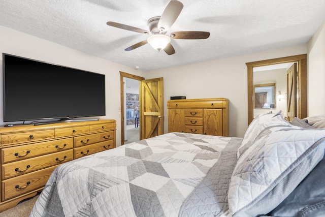 14410 Native Dr, Phillipsburg, MO 65722 - bedroom with carpet floors, a textured ceiling, and ceiling fan