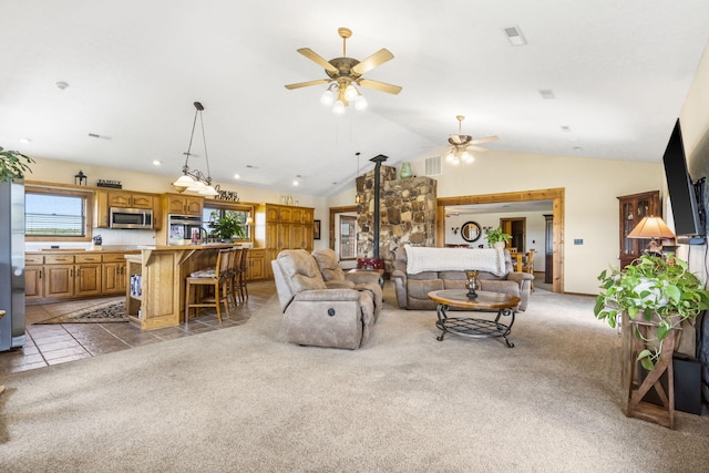 14410 Native Dr, Phillipsburg, MO 65722 - carpeted living area featuring ceiling fan and vaulted ceiling