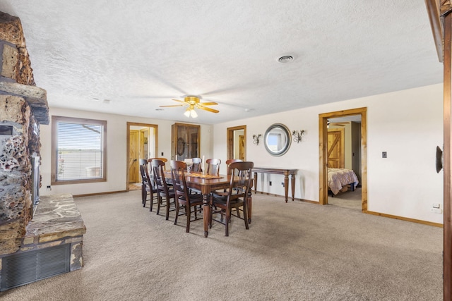 14410 Native Dr, Phillipsburg, MO 65722 - dining area with light carpet, ceiling fan, and a textured ceiling