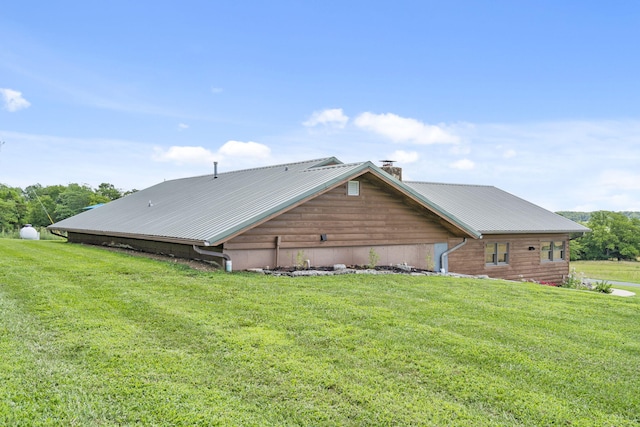 14410 Native Dr, Phillipsburg, MO 65722 - rear view of property with a chimney, a yard, and a metal roof