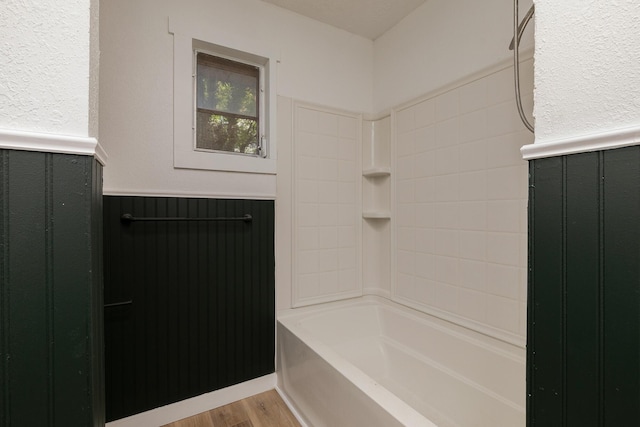 2716 W Elm St, Springfield, MO 65802 - full bathroom featuring wainscoting, wood finished floors, and shower / tub combination