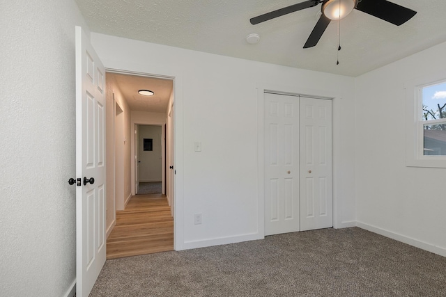 2716 W Elm St, Springfield, MO 65802 - unfurnished bedroom featuring carpet floors, a closet, and ceiling fan