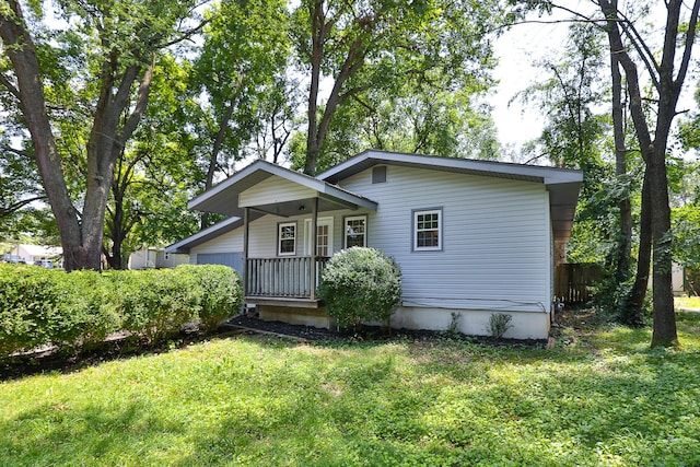 2716 W Elm St, Springfield, MO 65802 - view of front of house featuring a front yard and covered porch