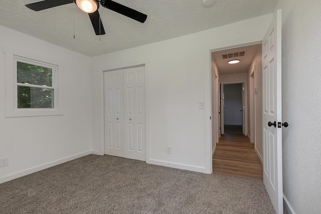 2716 W Elm St, Springfield, MO 65802 - unfurnished bedroom featuring carpet flooring, a closet, and ceiling fan