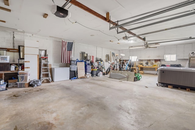 2616 Schupbach Rd, Clever, MO 65631 - garage with a garage door opener and a workshop area
