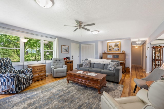 2616 Schupbach Rd, Clever, MO 65631 - living area with wood finished floors, ceiling fan, and a textured ceiling