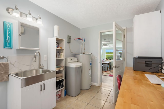 2616 Schupbach Rd, Clever, MO 65631 - laundry area with water heater, ceiling fan, light tile patterned floors, and a textured ceiling