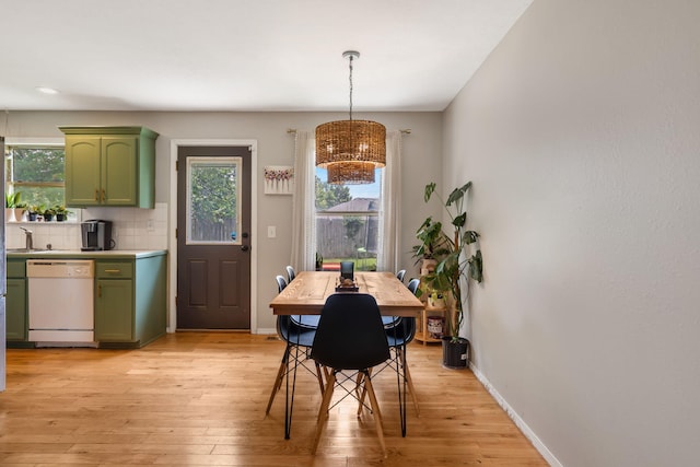 578 Stoney Path, Nixa, MO 65714 - dining room with a chandelier, plenty of natural light, and light wood-style floors