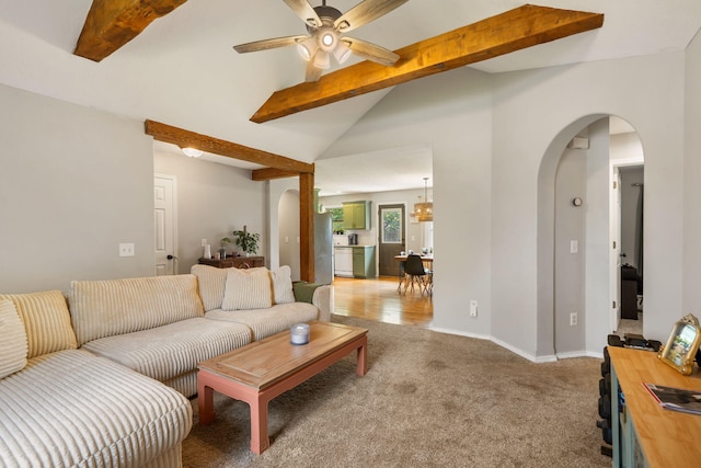 578 Stoney Path, Nixa, MO 65714 - living area featuring arched walkways, a ceiling fan, and light colored carpet