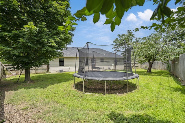578 Stoney Path, Nixa, MO 65714 - fenced backyard featuring a trampoline