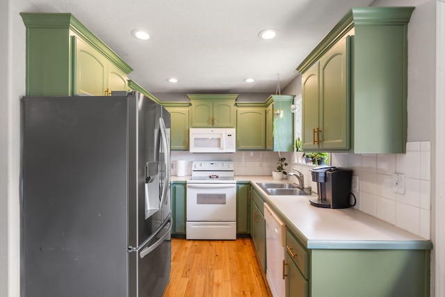 578 Stoney Path, Nixa, MO 65714 - kitchen with green cabinets, white appliances, light countertops, light wood-type flooring, and recessed lighting