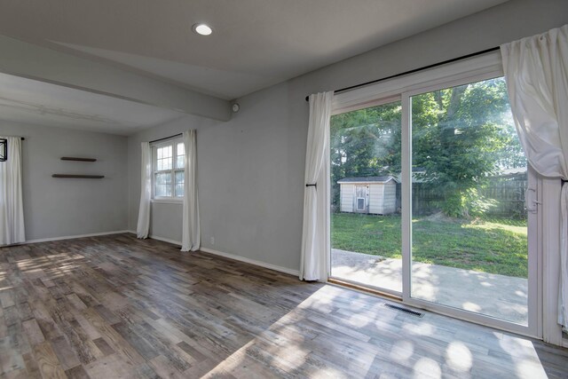 2525 New Hampshire Ave, Joplin, MO 64804 - unfurnished living room with wood finished floors and recessed lighting