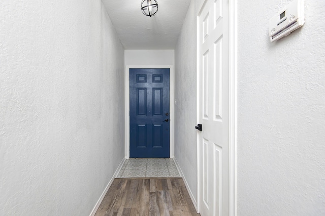 2525 New Hampshire Ave, Joplin, MO 64804 - doorway with wood finished floors and a textured wall