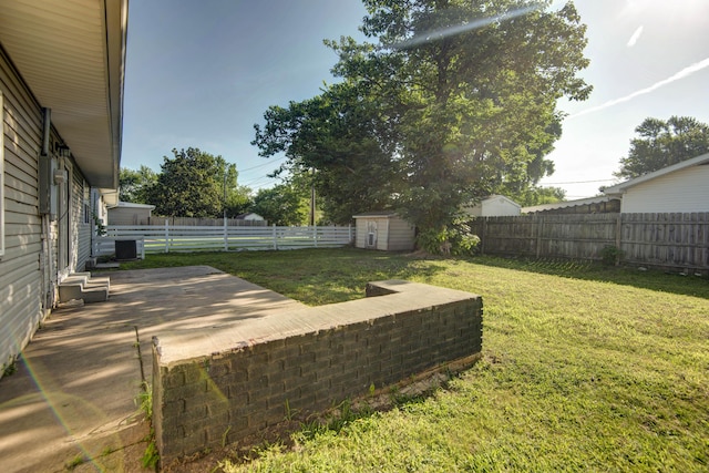 2525 New Hampshire Ave, Joplin, MO 64804 - fenced backyard with a patio area and a storage shed