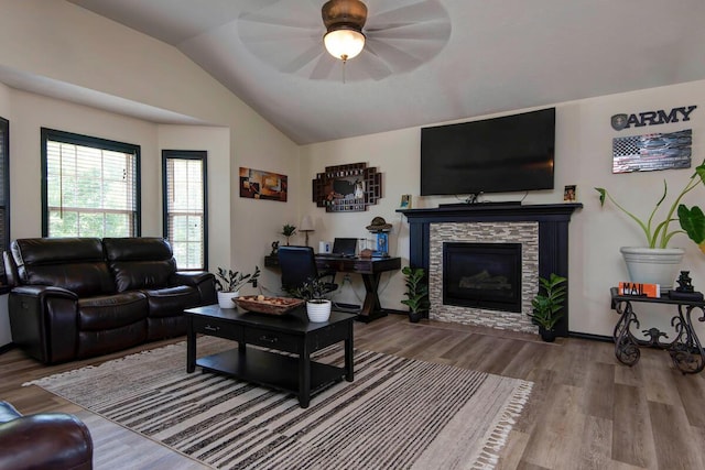 579 Lantern Hill Rd, Nixa, MO 65714 - living area with vaulted ceiling, wood finished floors, a stone fireplace, and ceiling fan