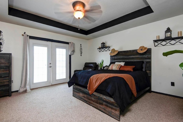 579 Lantern Hill Rd, Nixa, MO 65714 - carpeted bedroom with french doors, access to exterior, a tray ceiling, and a ceiling fan
