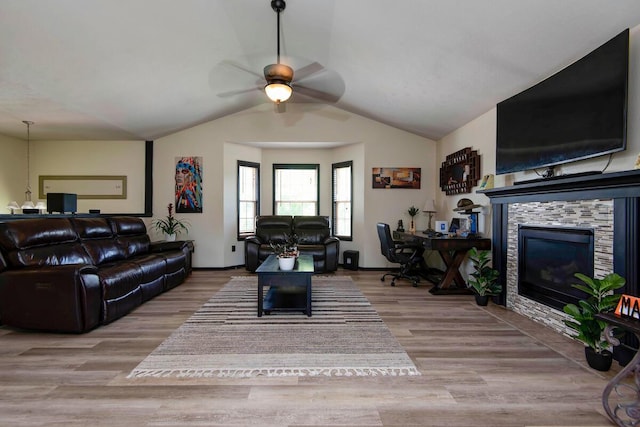 579 Lantern Hill Rd, Nixa, MO 65714 - living area with a ceiling fan, a stone fireplace, wood finished floors, and vaulted ceiling