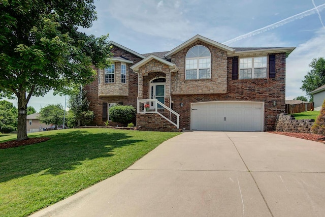579 Lantern Hill Rd, Nixa, MO 65714 - raised ranch with concrete driveway, an attached garage, and a front yard